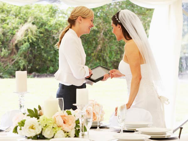 A bride discussing with her wedding planner